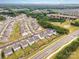 Aerial view of a well-planned neighborhood with homes featuring lush landscaping, sidewalks, and community amenities at 16200 Winfield Hall Dr, Charlotte, NC 28273