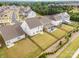 An aerial view of a neighborhood with houses that feature well-maintained lawns and backyard fences at 16200 Winfield Hall Dr, Charlotte, NC 28273