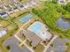 Aerial view of community amenities including a swimming pool, tennis court, playground and clubhouse at 16200 Winfield Hall Dr, Charlotte, NC 28273