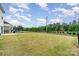 A wide expanse of lush lawn enclosed by a secure fence, offering a private and serene outdoor area at 16200 Winfield Hall Dr, Charlotte, NC 28273