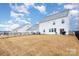 Backyard featuring white houses with black fences and a grass lawn at 16200 Winfield Hall Dr, Charlotte, NC 28273