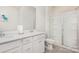 Beautiful bathroom featuring double sinks, modern cabinetry, and glass door shower at 16200 Winfield Hall Dr, Charlotte, NC 28273