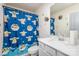 Bathroom featuring a blue Yoda themed shower curtain, white sink, and vanity at 16200 Winfield Hall Dr, Charlotte, NC 28273