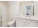 Clean bathroom with a glass enclosed shower, modern toilet, and sink with vanity at 16200 Winfield Hall Dr, Charlotte, NC 28273