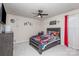 Themed bedroom with dark wood frame bed, ceiling fan and TV at 16200 Winfield Hall Dr, Charlotte, NC 28273