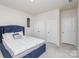 Comfortable bedroom with a blue bed, ample closet space, and neutral decor at 16200 Winfield Hall Dr, Charlotte, NC 28273