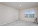 Bright bedroom featuring a large window and neutral walls and carpet at 16200 Winfield Hall Dr, Charlotte, NC 28273