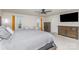 Spacious bedroom with a ceiling fan, TV, and large windows with beautiful views at 16200 Winfield Hall Dr, Charlotte, NC 28273