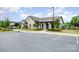 Exterior view of the community clubhouse with ample parking and well-maintained landscaping at 16200 Winfield Hall Dr, Charlotte, NC 28273
