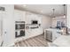 Bright kitchen featuring white cabinets, stainless steel appliances, and modern countertops at 16200 Winfield Hall Dr, Charlotte, NC 28273