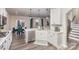 Well-lit kitchen with an island featuring a sink and seating, open to a dining area at 16200 Winfield Hall Dr, Charlotte, NC 28273