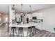 Bright, modern kitchen featuring white cabinetry, quartz countertops, stainless steel appliances, and stylish pendant lighting at 16200 Winfield Hall Dr, Charlotte, NC 28273