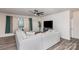 Spacious living room featuring a large sectional sofa, a ceiling fan, and a flat screen TV at 16200 Winfield Hall Dr, Charlotte, NC 28273