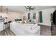 Open-concept living room featuring a large sectional sofa, a ceiling fan, and connection to kitchen at 16200 Winfield Hall Dr, Charlotte, NC 28273