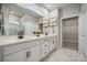 Bright bathroom features double sinks, sleek countertops and a walk-in closet at 2029 Mantle Ridge Dr, Indian Trail, NC 28079