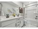 Bathroom featuring a double vanity, sleek fixtures, and a shower-tub combination at 2029 Mantle Ridge Dr, Indian Trail, NC 28079