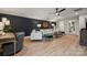 Stylishly furnished living room boasts hardwood floors and accent wall at 2029 Mantle Ridge Dr, Indian Trail, NC 28079