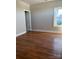 Bright bedroom with hardwood floors and a window with natural light at 211 S Webb St, Gastonia, NC 28052