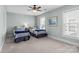 Cozy bedroom with two twin beds, soft carpet, and natural light from the windows at 21812 Chapel Way # 20, Cornelius, NC 28031