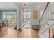 Elegant foyer with hardwood floors, staircase, and a view through the front door of the landscaped front yard at 21812 Chapel Way # 20, Cornelius, NC 28031