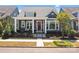 Charming home featuring a cozy front porch with comfortable seating and attractive curb appeal at 21812 Chapel Way # 20, Cornelius, NC 28031