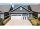 Spacious two-car garage with ample parking space and convenient exterior storage at 21812 Chapel Way # 20, Cornelius, NC 28031