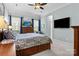 Spacious main bedroom with a ceiling fan, television, and large windows at 21812 Chapel Way # 20, Cornelius, NC 28031