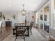 Cozy dining area featuring a stylish light fixture and seamless access to the outdoor living space at 2253 Prairie Rd, Concord, NC 28027