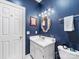 Stylish powder room features modern vanity, mirror, and fixtures, perfect for guests at 2310 Roswell Ave # H, Charlotte, NC 28207