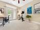 Bright bedroom area with exercise bike and private balcony, perfect for fitness and relaxation at 2310 Roswell Ave # H, Charlotte, NC 28207