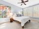 Comfortable bedroom with plush carpet, ceiling fan, bright windows and calming ambiance at 2310 Roswell Ave # H, Charlotte, NC 28207