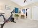Bright bedroom area with exercise bike, perfect for fitness and relaxation at 2310 Roswell Ave # H, Charlotte, NC 28207