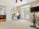 Bright bedroom area with desk, exercise bike, and private balcony, perfect for fitness and relaxation at 2310 Roswell Ave # H, Charlotte, NC 28207