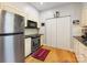 Efficient kitchen with stainless steel appliances, ample cabinetry and beautiful hardwood floors at 2310 Roswell Ave # H, Charlotte, NC 28207