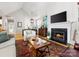 Cozy living room featuring a modern fireplace, comfortable seating, and stylish decor at 2310 Roswell Ave # H, Charlotte, NC 28207
