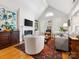 Elegant living room features a cozy fireplace, ample seating, and plenty of natural light at 2310 Roswell Ave # H, Charlotte, NC 28207
