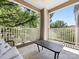 Inviting covered porch with neutral outdoor rug and seating area offering relaxing views at 2310 Roswell Ave # H, Charlotte, NC 28207