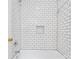 Bathroom shower showcasing bright white subway tile from floor to ceiling at 2310 Roswell Ave # H, Charlotte, NC 28207
