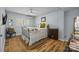 Cozy bedroom with wood floors, a ceiling fan, and a comfortable bed at 2503 Roswell Ave # 208, Charlotte, NC 28209