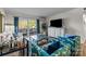 Bright living room featuring stylish furniture and an outdoor balcony at 2503 Roswell Ave # 208, Charlotte, NC 28209