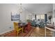 Inviting dining and living spaces with hardwood floors and natural light at 2503 Roswell Ave # 208, Charlotte, NC 28209