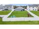 Expansive fenced-in backyard featuring lush green lawn, fire pit, playset, and outdoor seating; ideal for Gathering enjoyment at 2766 Sherrills Stream Dr, Sherrills Ford, NC 28673