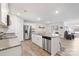 Modern kitchen featuring stainless steel appliances, granite countertops, and a spacious island with bar seating at 2766 Sherrills Stream Dr, Sherrills Ford, NC 28673