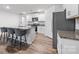 Modern kitchen features white cabinetry, granite countertops, stainless steel appliances, and center island with seating at 2766 Sherrills Stream Dr, Sherrills Ford, NC 28673