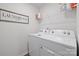 Laundry room with a washer, dryer, and shelving for storage at 2766 Sherrills Stream Dr, Sherrills Ford, NC 28673