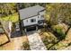 Aerial view of a modern home featuring a well-manicured lawn, driveway, and garage at 3020 Georgia Ave, Charlotte, NC 28205