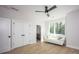 Bedroom featuring hardwood floors, a white couch and natural light from the window at 3020 Georgia Ave, Charlotte, NC 28205