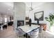 Elegant dining area with a stone-top table, stylish chairs, and fireplace view at 3020 Georgia Ave, Charlotte, NC 28205