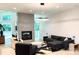 Open-concept living area with fireplace and hardwood floors at 3020 Georgia Ave, Charlotte, NC 28205