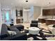 Living area with modern furnishings, wet bar, and sleek staircase at 3020 Georgia Ave, Charlotte, NC 28205